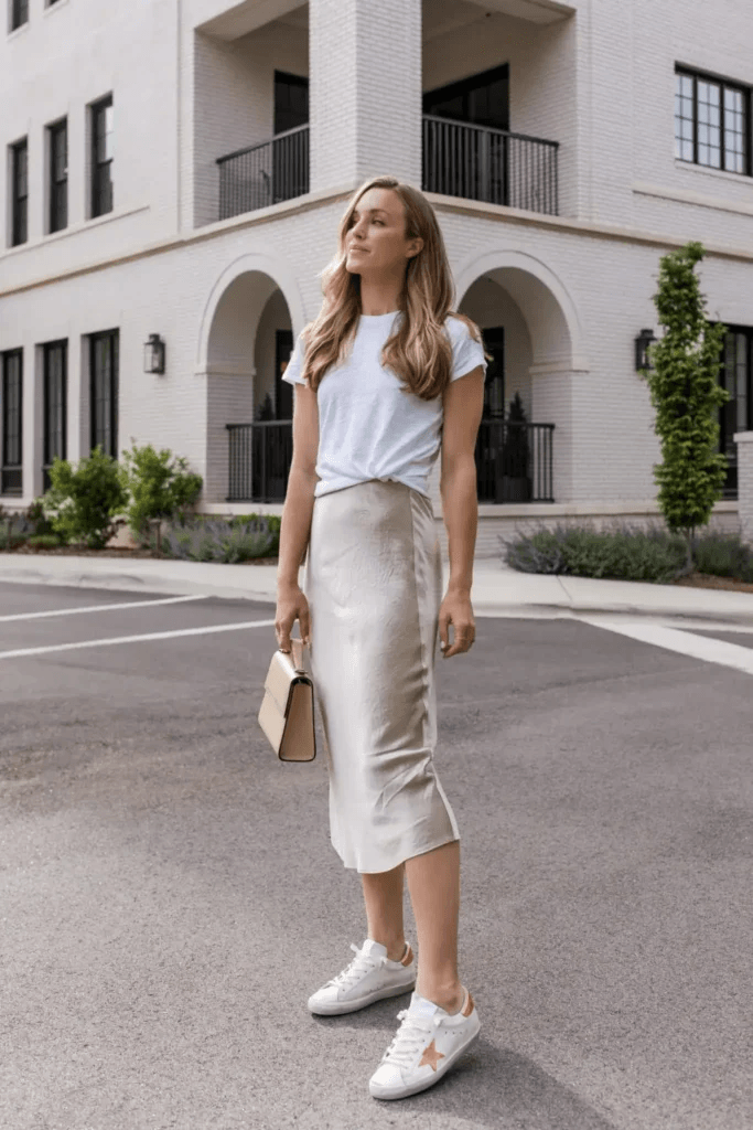 White shirt tucked into a silk midi skirt: