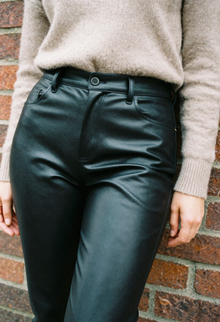  A texture-focused winter outfit with leather pants and a soft cashmere sweater.